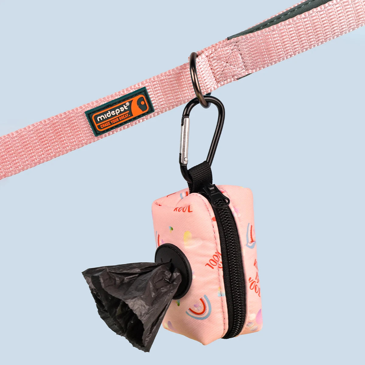 Clip waste bag holder attached to a leash dispensing a bag