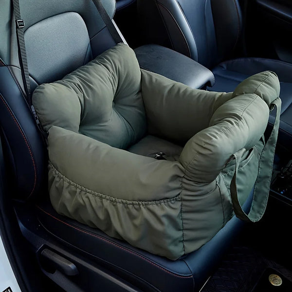 Small dog in the green Cruise car booster seat