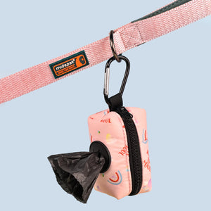 Clip waste bag holder attached to a leash dispensing a bag