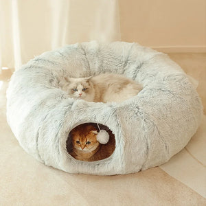 Cat curled up in the Nest plush donut bed