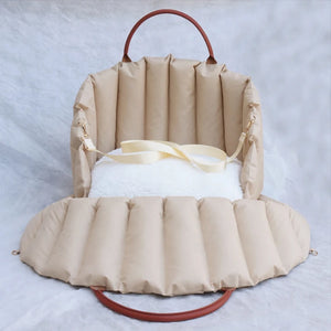 Travel Booster «Voyage» in light grey — side view of the padded booster seat