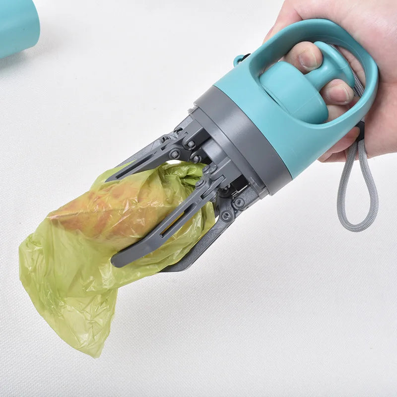 Grab no-touch poop scooper holding a bag