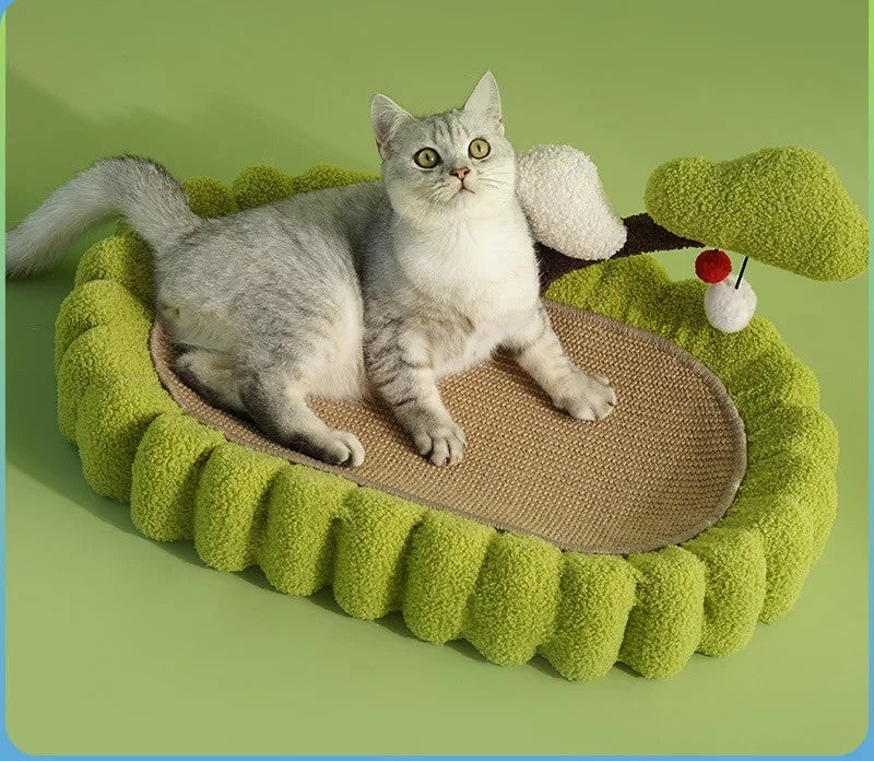 Cat lounging on the green Scratch Nest Siesta with scratching post